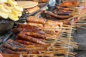 Grilled skewers or shaokao sold on the street in Chongqing, China. S