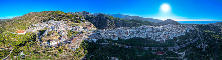 Naklejka premium Golden Hour Village: Stunning Aerial Sunrise View Over Frigiliana, the Iconic White Village Pueblo Blanco of Andalusia, Spain
