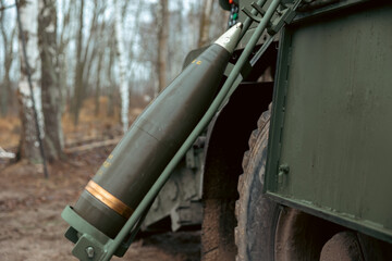 artillery shell 155 mm on combat vehicle platform. artillery shell on a combat vehicle