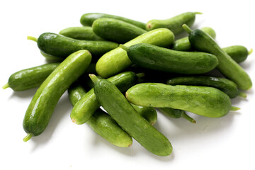 Fresh mini baby cucumbers on white background