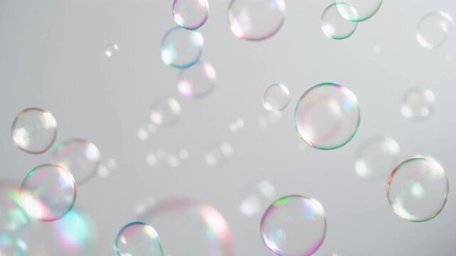 soap bubbles floating in the air with white background