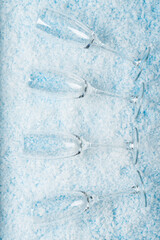 Champagne Glasses on Snowy. New Year celebrations, festive toasts, winter holiday designs, party invitations,
