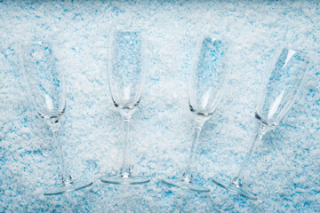 Champagne Glasses on Snowy. New Year celebrations, festive toasts, winter holiday designs, party invitations,