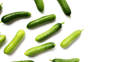 Fresh mini baby cucumbers on white background