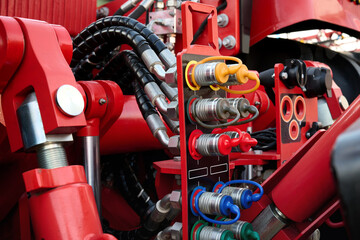 Close-up of the back of a tractor red color. Auxiliary nodes for connecting various equipment.