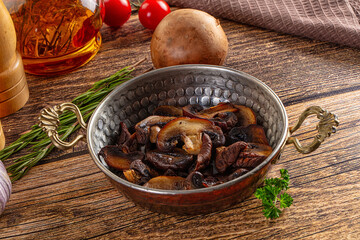 Fried champignon slices in the plate