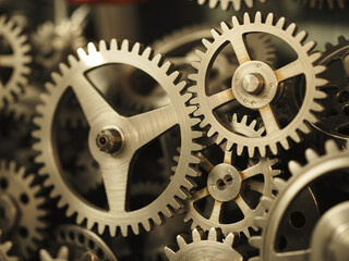 Intricate metal gears interlocking to power complex machinery, representing precision, industry, and mechanical innovation in motion