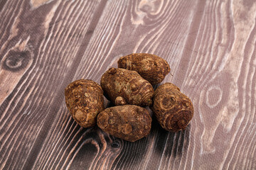 Brown topinambur roots for cooking