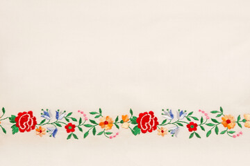 Bright embroidery on white canvas with copy space