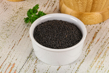 Black dry Nigella seeds in the bowl