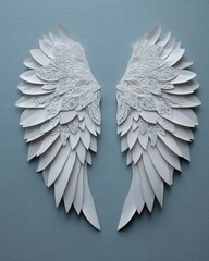 Fototapeta premium White paper angel wings art on light background