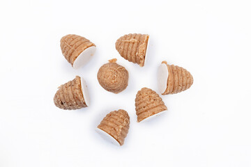 Traditional Silesian bee-hive shaped cookies made from ground nuts on a clean white background, regional Polish dessert prepared for holidays and local culinary culture