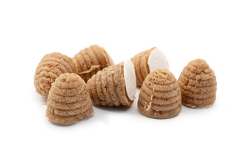 Traditional Silesian bee-hive shaped cookies made from ground nuts on a clean white background, regional Polish dessert prepared for holidays and local culinary culture