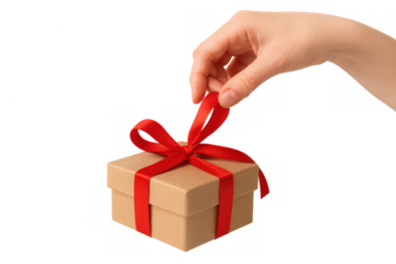 Hand untying a red ribbon on a brown cardboard gift box, symbolizing opening a present or unboxing a special discovery