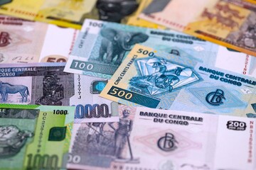 Congolese franc money bills in big amount on table close up. Rich life concept in Democratic Republic of Congo. Business and economy