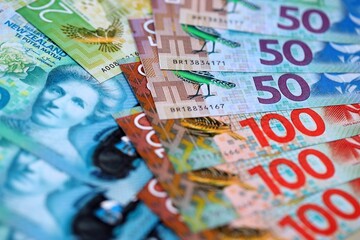 New Zealand dollar money bills in big amount on table close up. Rich life concept in New Zealand. Business and economy
