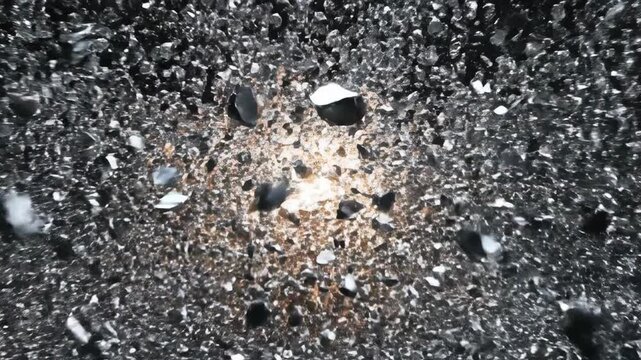 Slow motion cinematic shot of a heavy dark metallic sphere dramatically imploding and shattering into countless sharp, silver fragments design, destruction, particles