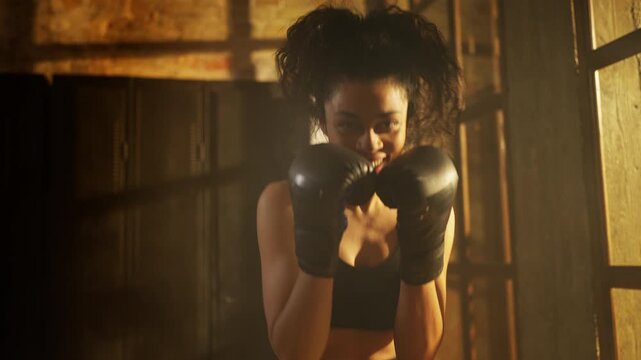 POV of African American female boxer practicing punches, preparing for fight