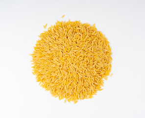 Raw orzo pasta, risoni or kritharaki pile
