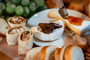 Gourmet Cheese Board with Brie, Fig Preserve, Wraps, and Fresh Bread