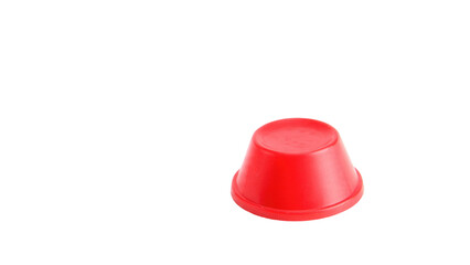 Fototapeta premium A vibrant red plastic cup, inverted, sits on a dark transparent background. It's a simple, isolated object shot with clear focus. background removed