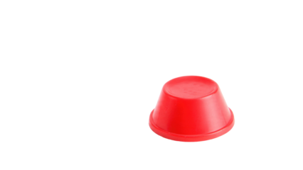 A vibrant red plastic cup, inverted, sits on a dark transparent background. It's a simple, isolated object shot with clear focus. background removed