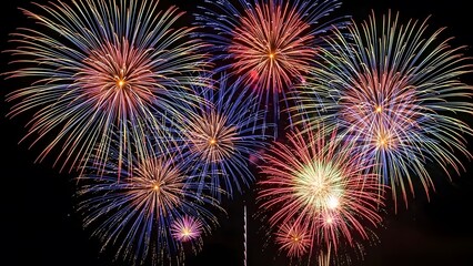 Colorful fireworks display against a dark night sky
