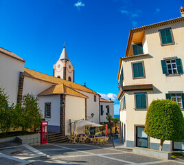 View of Ponta do Sol, a small touristic village in the city of Funchal, main avenue facing the sea, with residential buildings, Madeira Island, Portugal