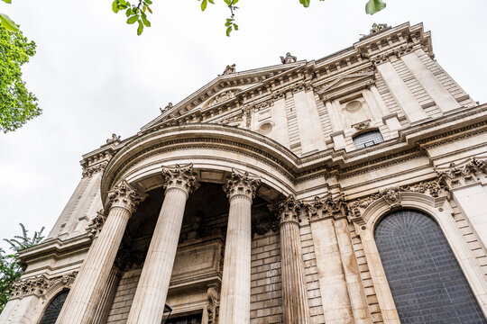 Colonnade and side view of St Paul's Cathedral, where the entrance for visitors is, seen from Canon Aly, London, United Kingdom.