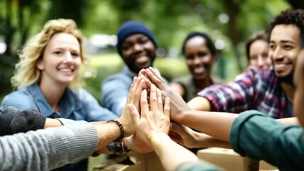 Diverse volunteers gathering, park afternoon assembly, care packages creating, community service project, teamwork camaraderie display, purposeful collaboration moment, nonprofit a - Powered by Adobe