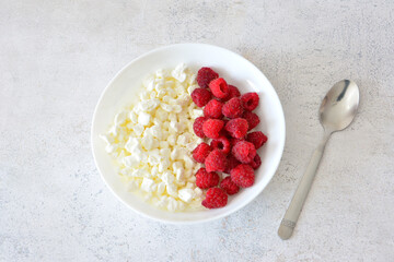 Healthy Breakfast Cottage Cheese with Fresh Raspberries top view cut out