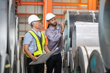 Engineers and inspectors collaborate on quality control in industrial manufacturing facilities