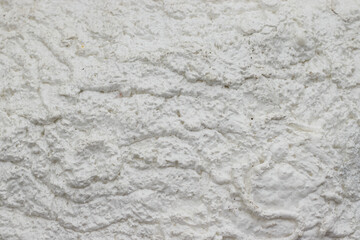 Embossed white surface texture with pressed patterns