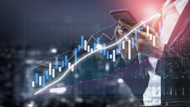 A business professional uses a smartphone to analyze financial data, with dynamic market graphs in the background, illustrating trends and growth strategies at night. Copula - Powered by Adobe