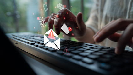 A close-up view of a person typing on a keyboard, with visual email alerts and notifications,...
