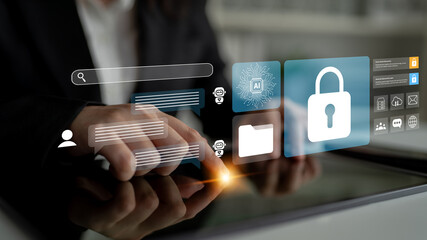 Digital security representation featuring hands using a tablet and a holographic interface, focusing on a lock icon and various data symbols in a contemporary workspace. Gantry
