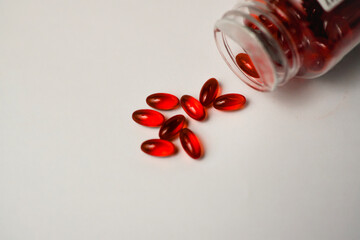 Red pill capsules, analgesic pile, painkiller drugs, sedative pills group, medicine gel capsules. Healthcare and medical concept.