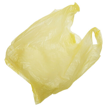 Yellow disposable shopping bag isolated on a transparent background. Real Low-Density Polyethylene plastic bag. LDPE shopper, plastic waste and pollution.
