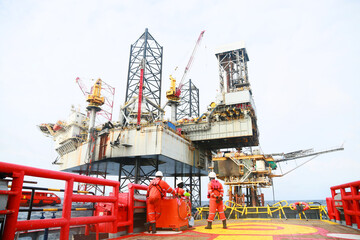 Crews boat moving the passenger and cargo from the platform to supply boat in oil and gas industry. Support offshore oil and gas industry by boat and service team.