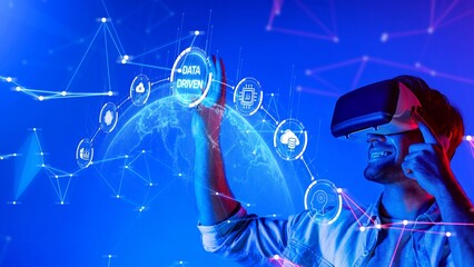 A young man immerses himself in virtual reality while engaging with floating data visuals. The colorful setup symbolizes innovation and technology future. Raster