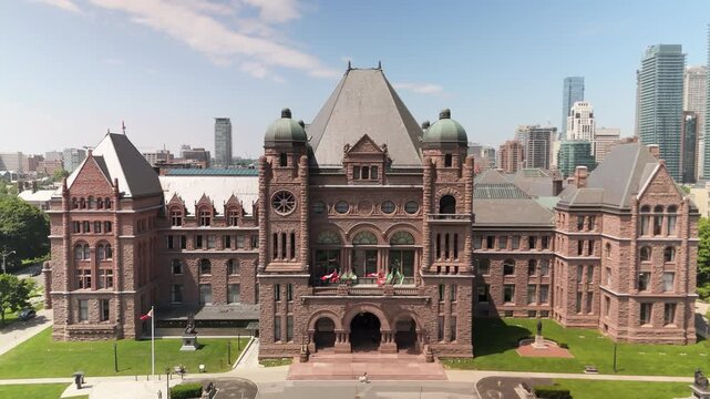 TORONTO, ONTARIO - JUNE 12 2024: Aerial view of Ontario Legislature building and city backdrop