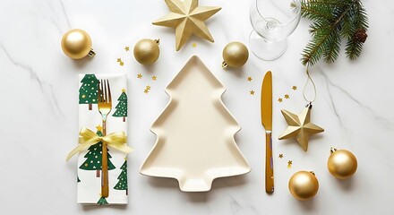 Christmas tree plate setting features gold ornaments and stars on white marble surface