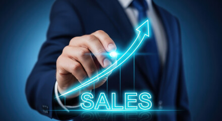 Hand in navy suit draws a glowing upward arrow labeled 'SALES' on a digital screen, symbolizing business growth and financial success. Focus on concept and growth.