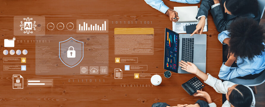 Business professionals engage in a collaborative meeting, utilizing technology to analyze data, showcase artificial intelligence concepts, and prioritize cybersecurity. Gantry
