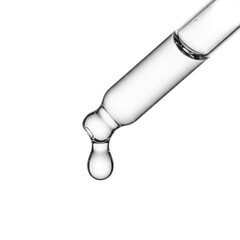 Clear liquid dripping from a glass dropper isolated on white background