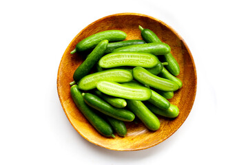 Fresh mini baby cucumbers on white background
