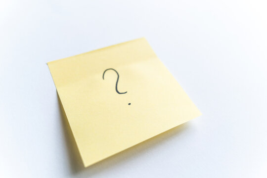 Yellow sticky note with question mark - Powered by Adobe