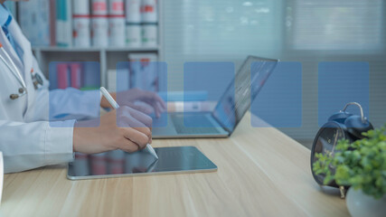 Doctor using digital tablet with stylus in modern medical office, working on electronic records with laptop and clean workspace, showing interface icons and text space for healthcare technology.