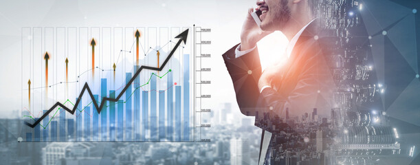 A dynamic image capturing a business professional engaged in a phone conversation about financial analytics and growth trends against an urban backdrop. Scalp