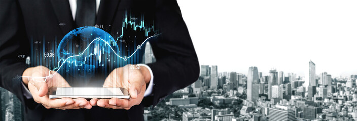 A professional businessman in a suit holds a tablet displaying digital financial graphs and a global sphere against a modern city skyline, symbolizing growth and technology. Scalp